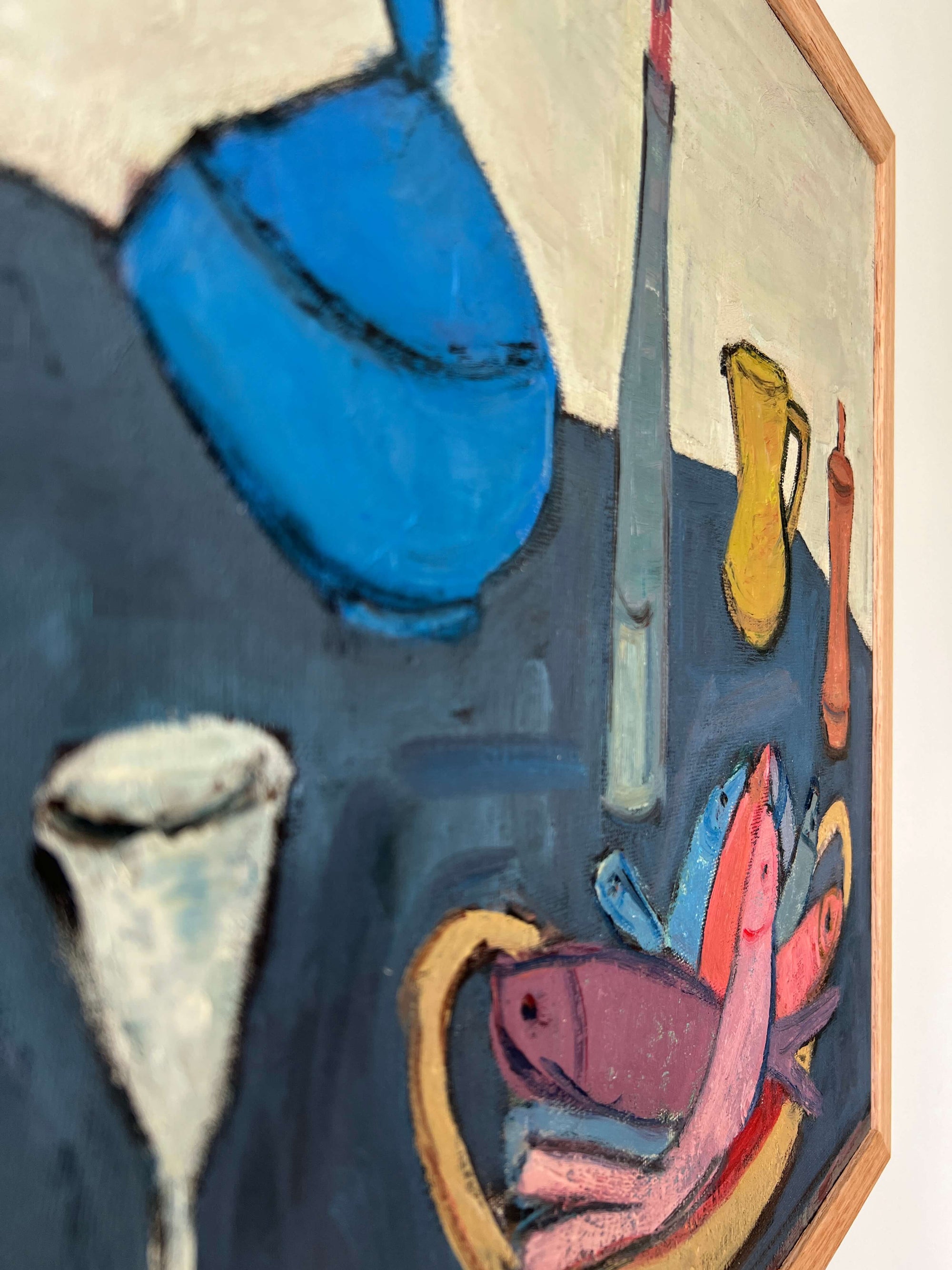 Close up of a vintage oil painting of still life objects on a  blue table. Flat shapes in post-cubist, mid-century style.