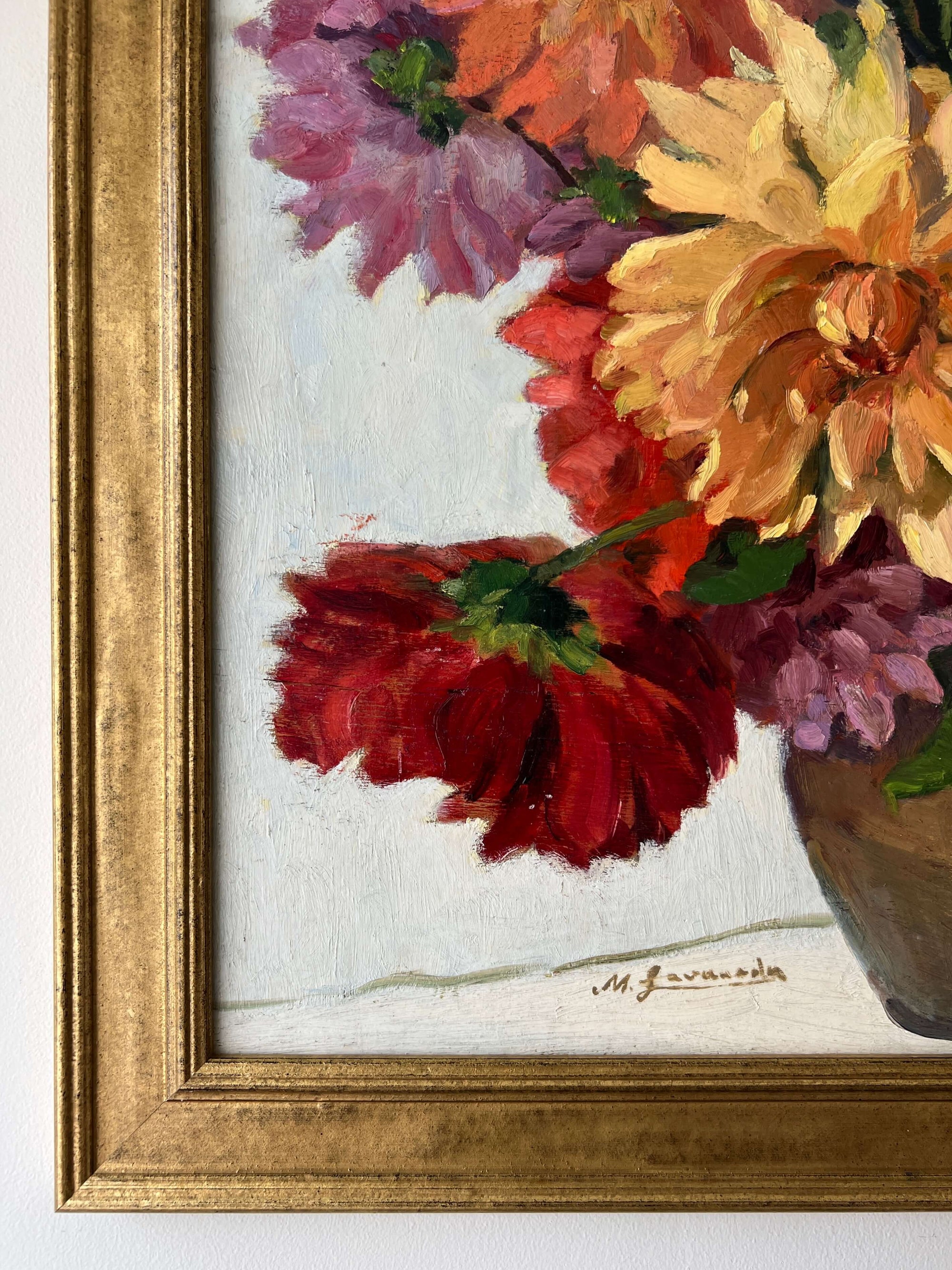 Framed, vintage, still life oil painting of a bouquet of red flowers.