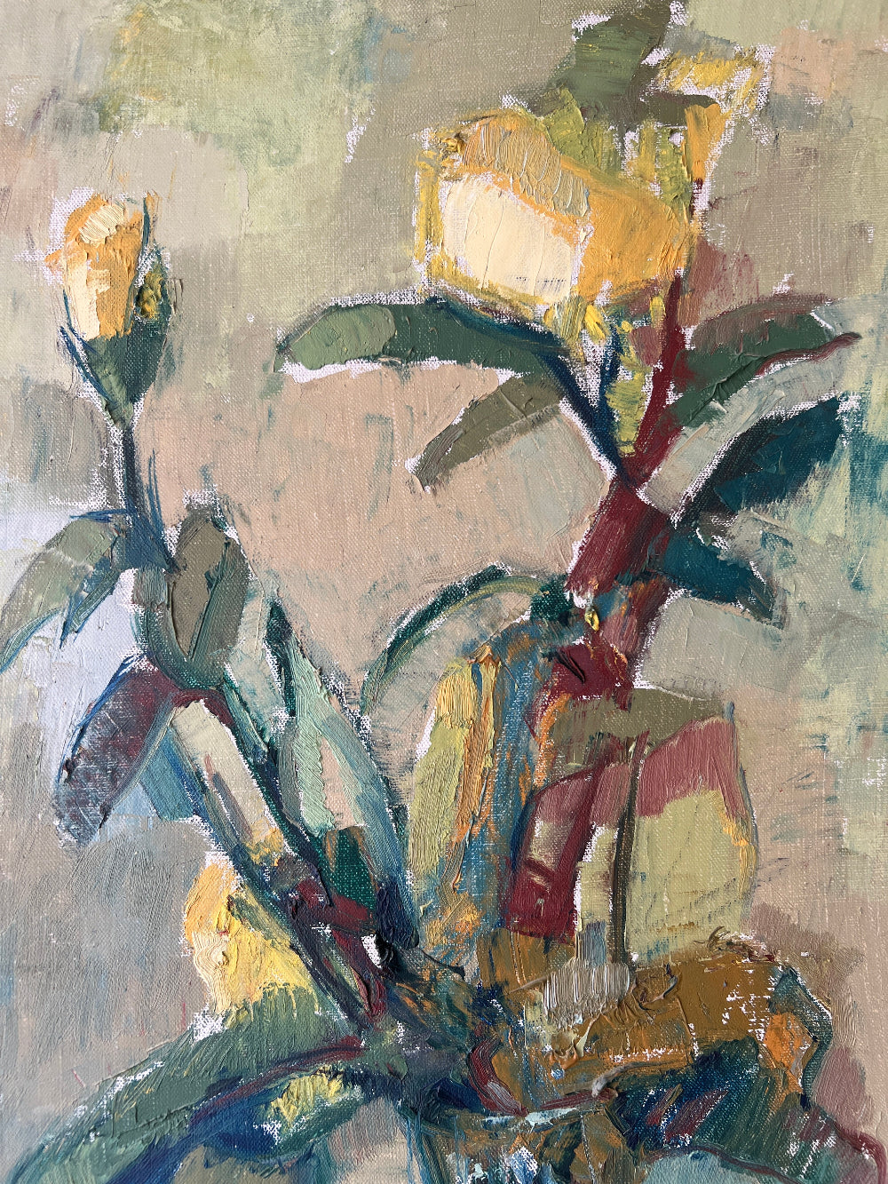 A close up of a vintage still life floral oil painting of yellow roses.