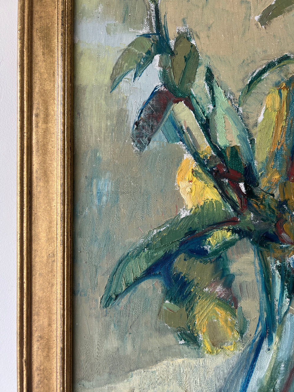 A close up of a vintage still life floral oil painting of yellow roses.