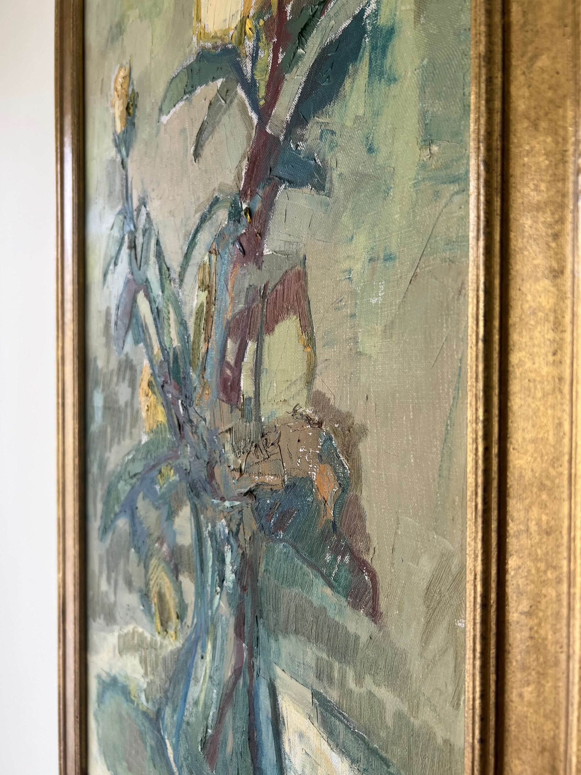 A close up of a vintage still life floral oil painting of yellow roses.