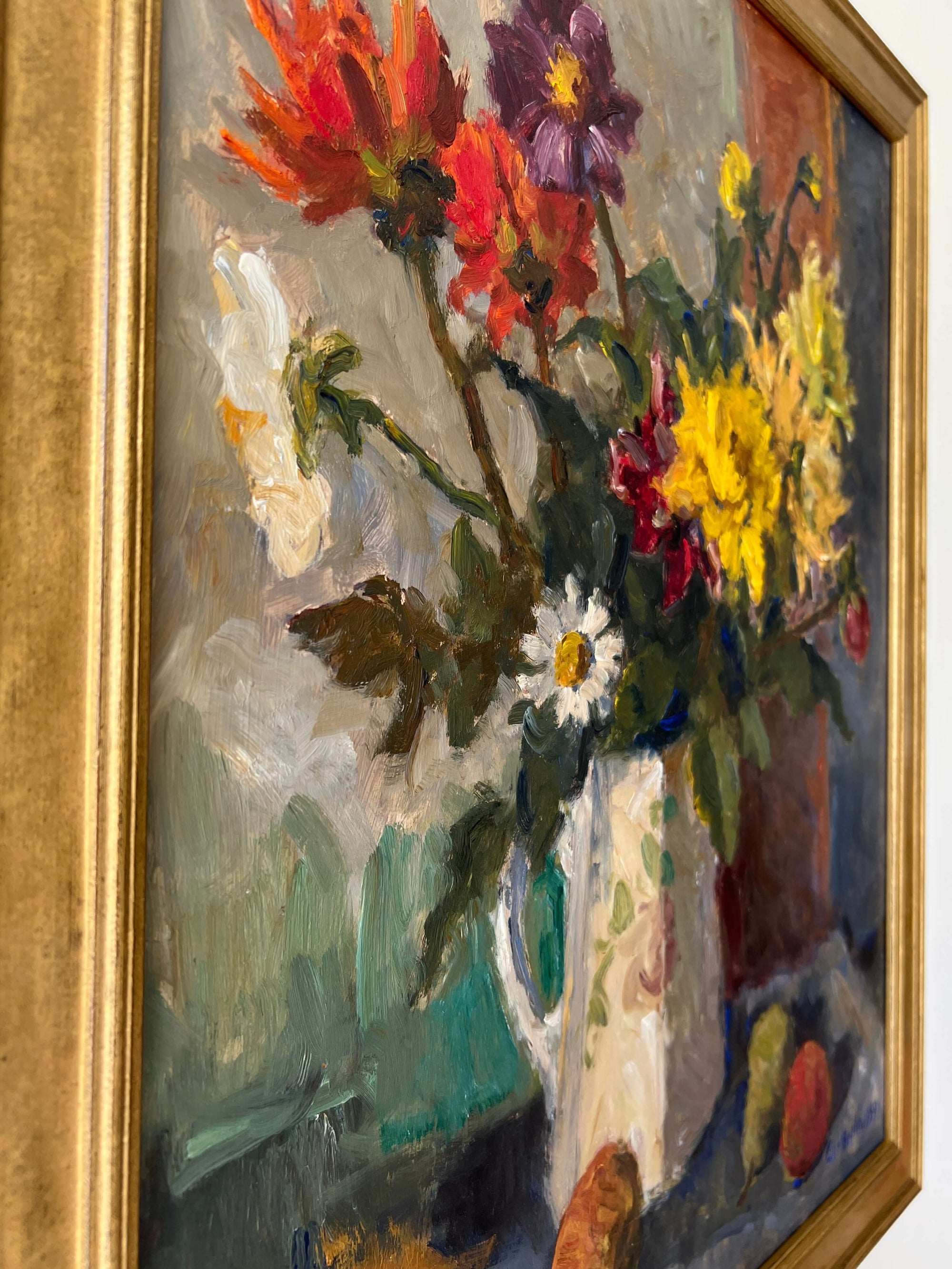 Close up of a framed impressionist oil painting on board of a bouquet of flowers with fruit. Still life art.