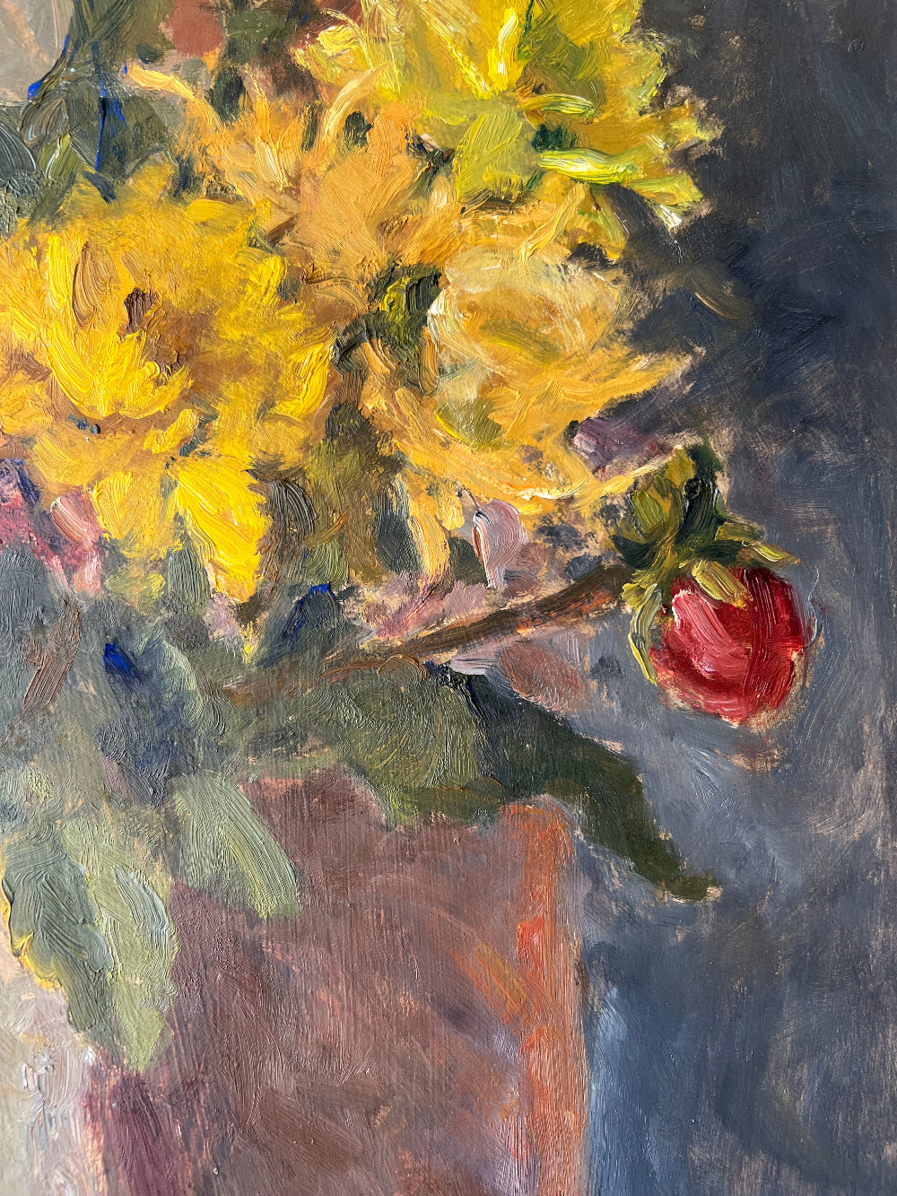 Close up of a framed impressionist oil painting on board of a bouquet of flowers with fruit. Still life art.
