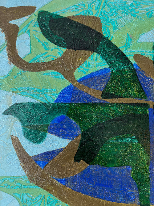 Close up of a framed, green & blue mixed media artwork with abstract design.