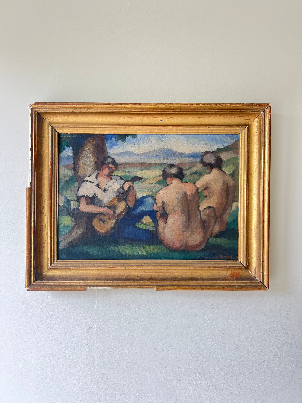 Framed vintage oil painting of a scene with people and nature 