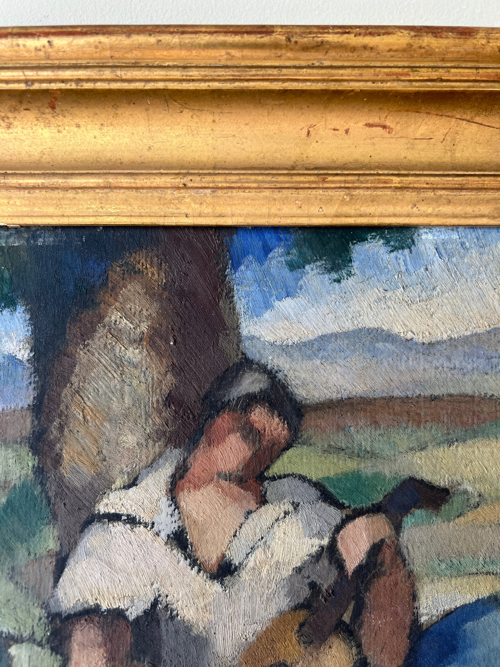 Framed vintage oil painting of a scene with people and nature 