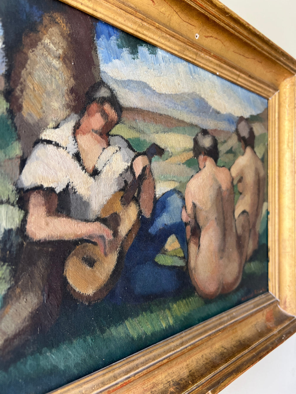 Framed vintage oil painting of a scene with people and nature 