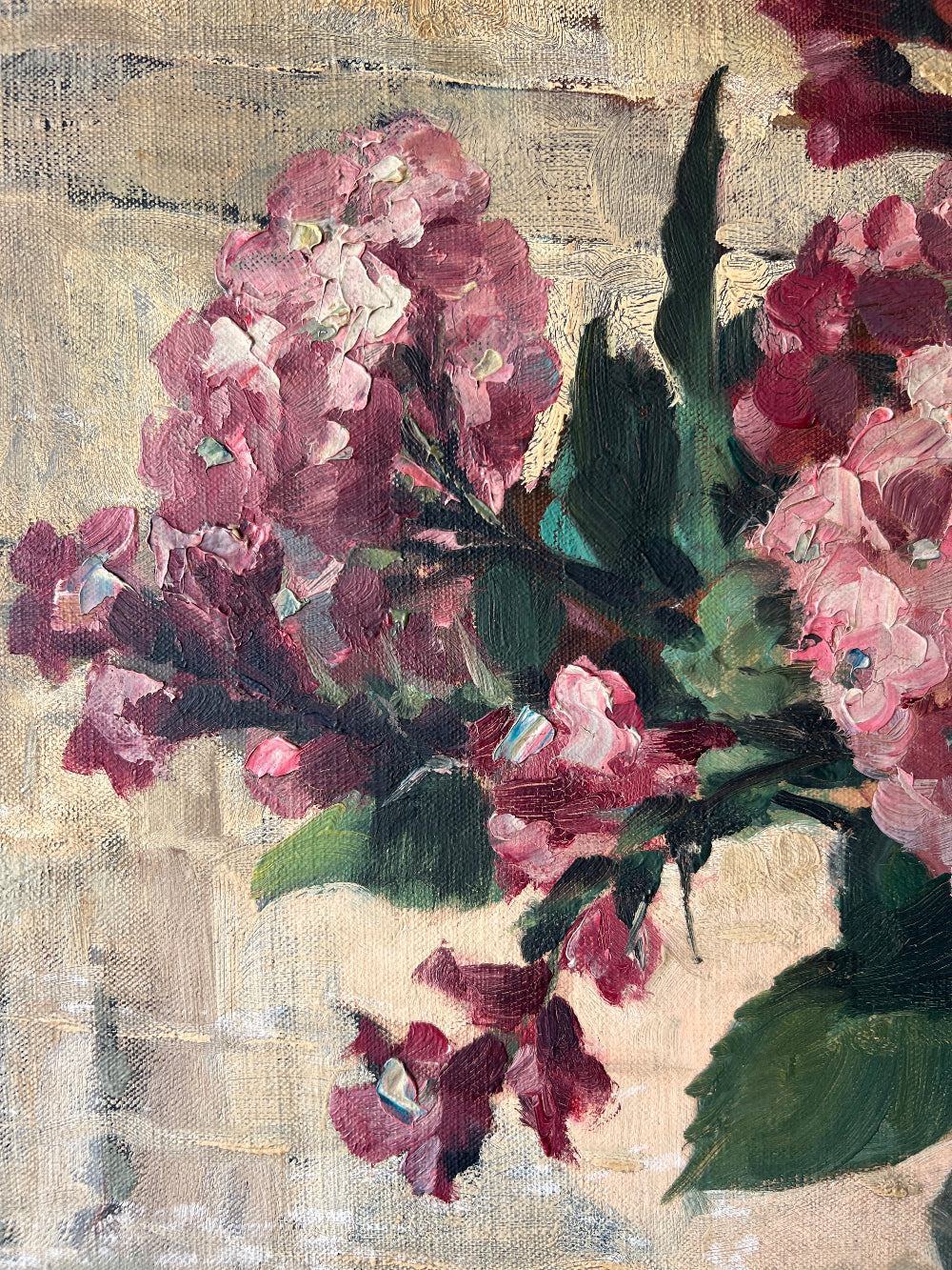 Close up of a vintage oil painting on canvas of a bouquet of dark pink hydrangeas in a glass vase. 