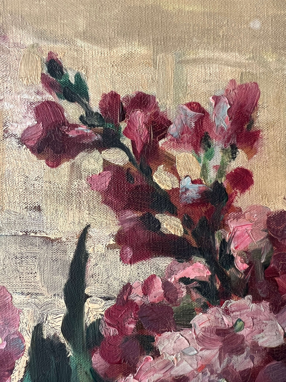 Close up of a vintage oil painting on canvas of a bouquet of dark pink hydrangeas in a glass vase. 