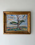 Framed vintage oil painting of a landscape with an old tree. Available at Hue. 
