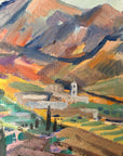 Close up of a framed, vintage oil painting on canvas of a mountainous coastal landscape with houses. Impressionist style.