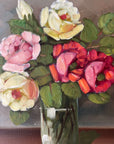 Framed, vintage artwork of roses in a glass vase. Impressionist oil painting.