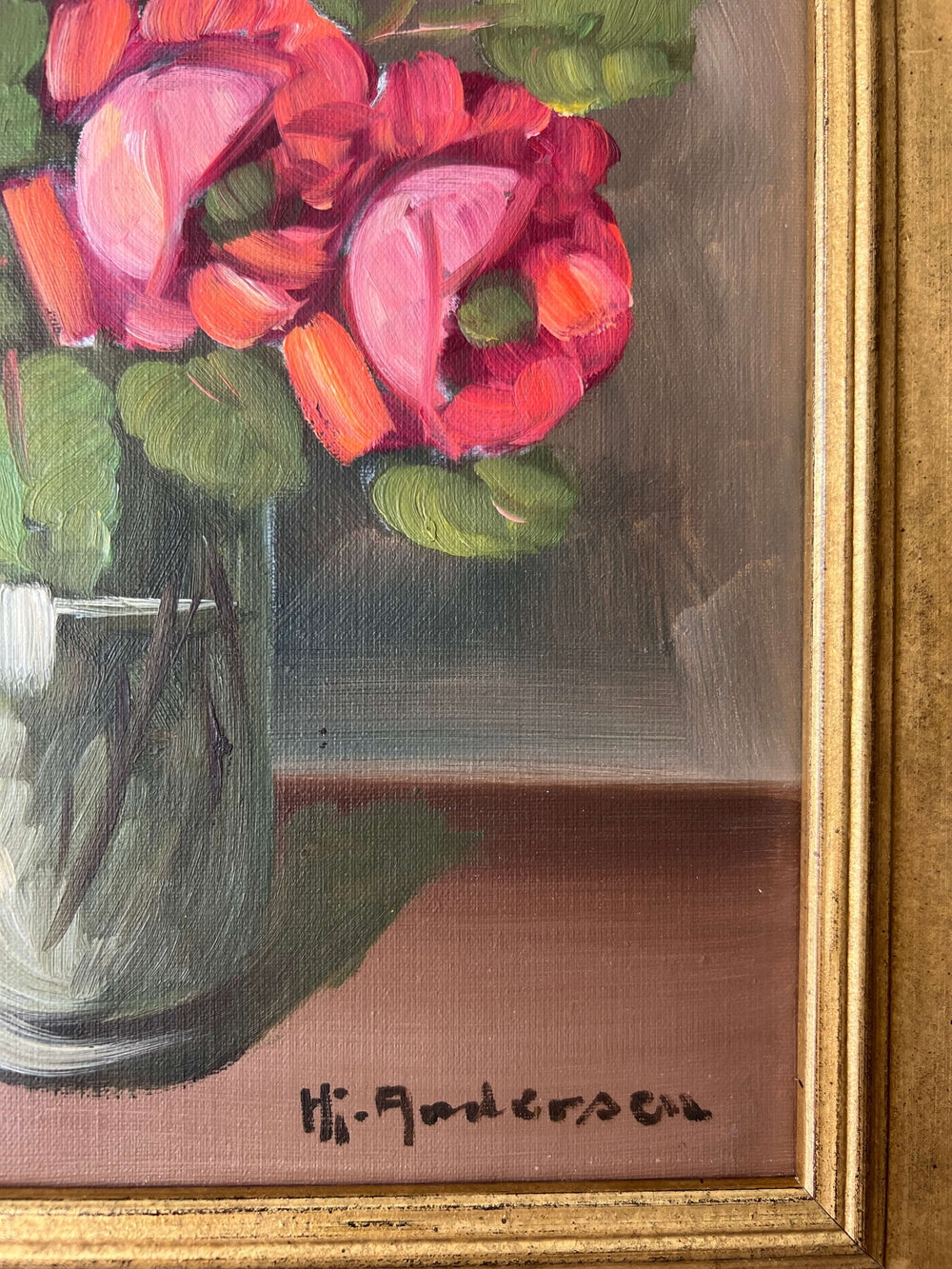 Framed, vintage artwork of roses in a glass vase. Impressionist oil painting.