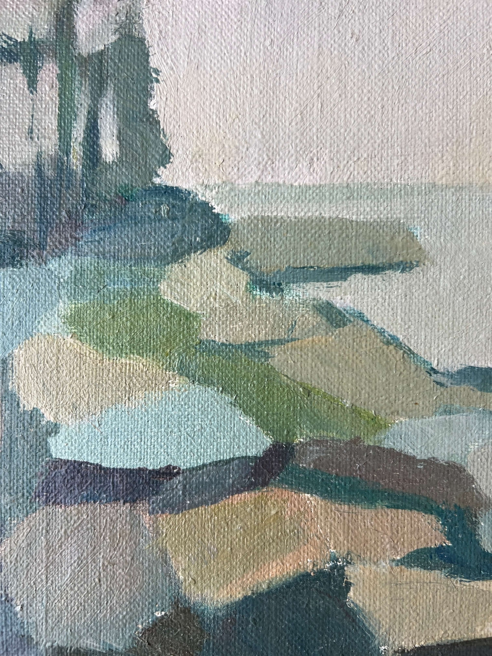 Close up of a framed semi-abstract landscape mid-century oil painting of a coastline.