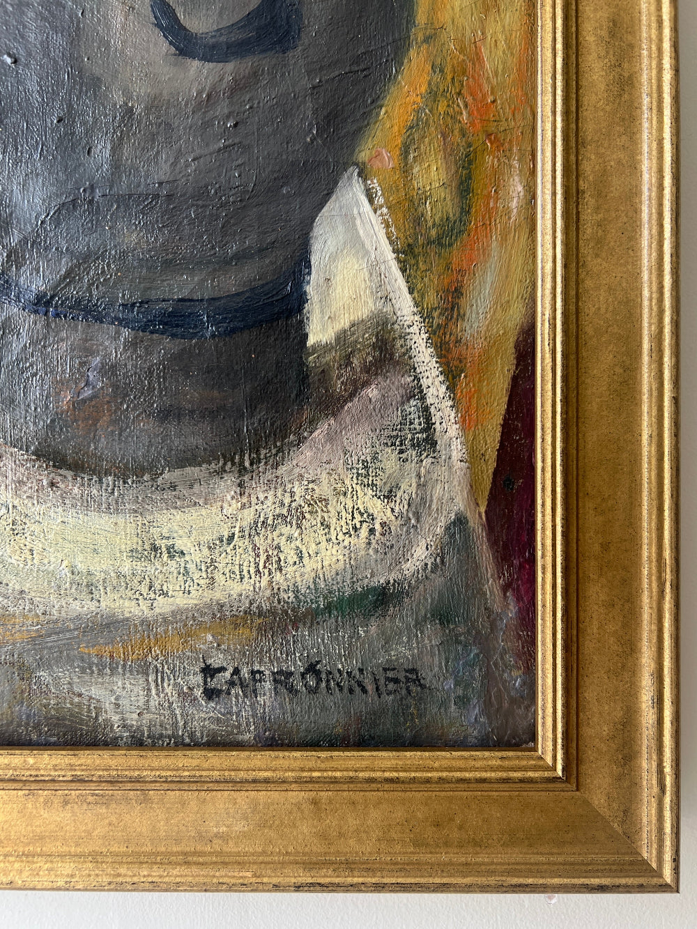 Close up of a framed still life oil vintage painting with watermelon, fruit, and jug on a table.