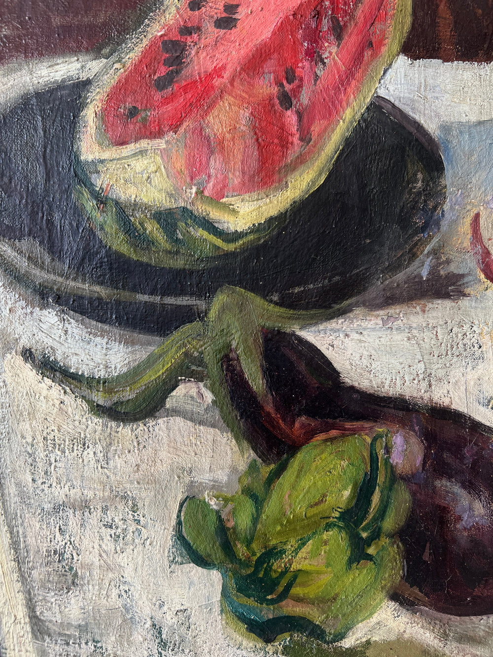 Close up of a framed still life oil vintage painting with watermelon, fruit, and jug on a table.