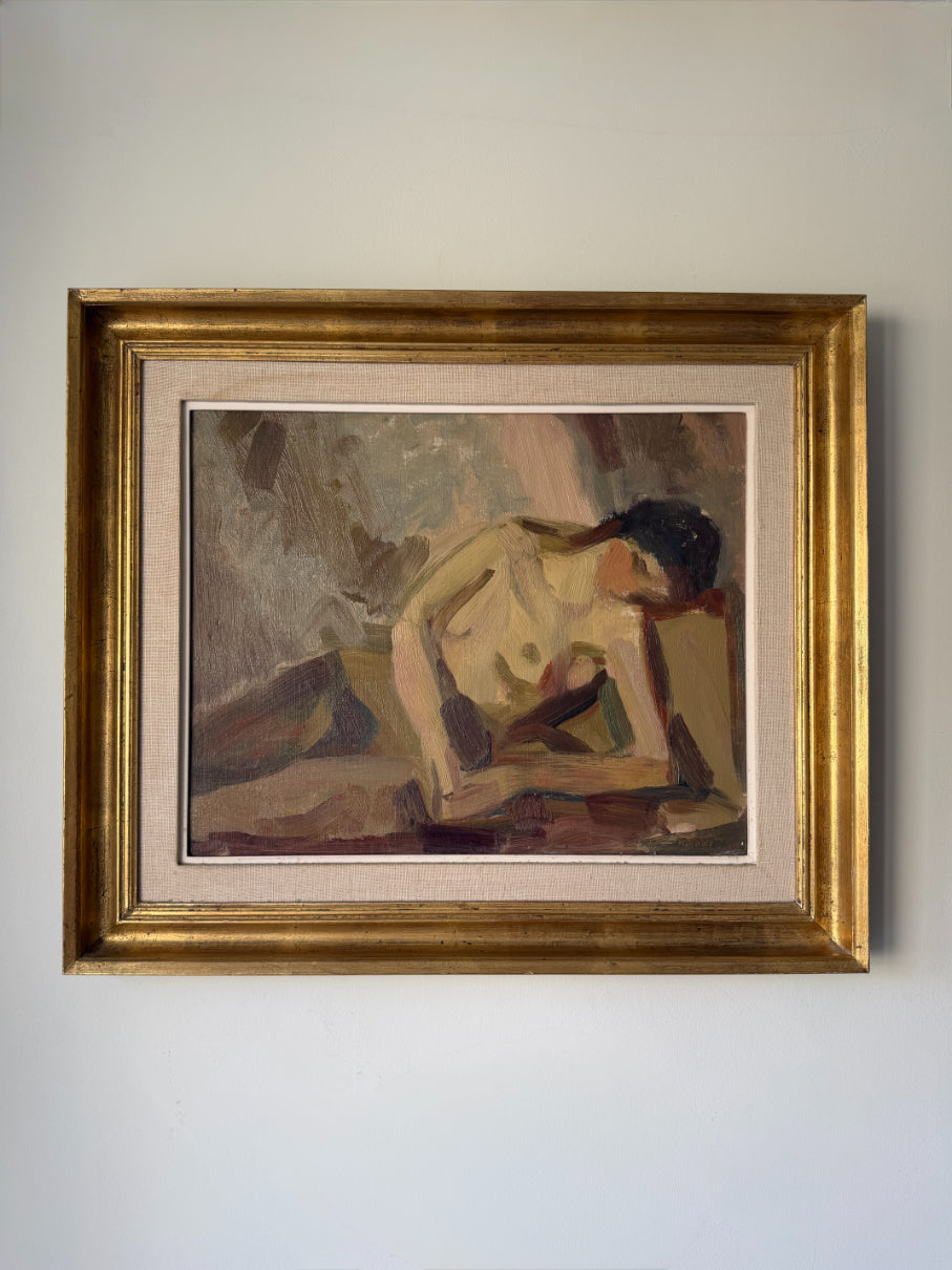 A framed vintage oil painting of a reclining nude figurel. The artwork features a textured, painterly style with earthy tones, enclosed in a wide gold frame. Available at Hue.