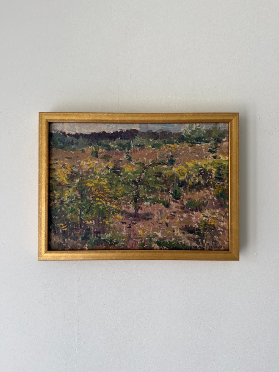 A framed vintage landscape painting featuring an impressionistic vineyard scene with green and yellow grapevines on brown soil, enclosed in a gold frame. Available at Hue. 