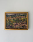 A framed vintage landscape painting featuring an impressionistic vineyard scene with green and yellow grapevines on brown soil, enclosed in a gold frame. Available at Hue. 