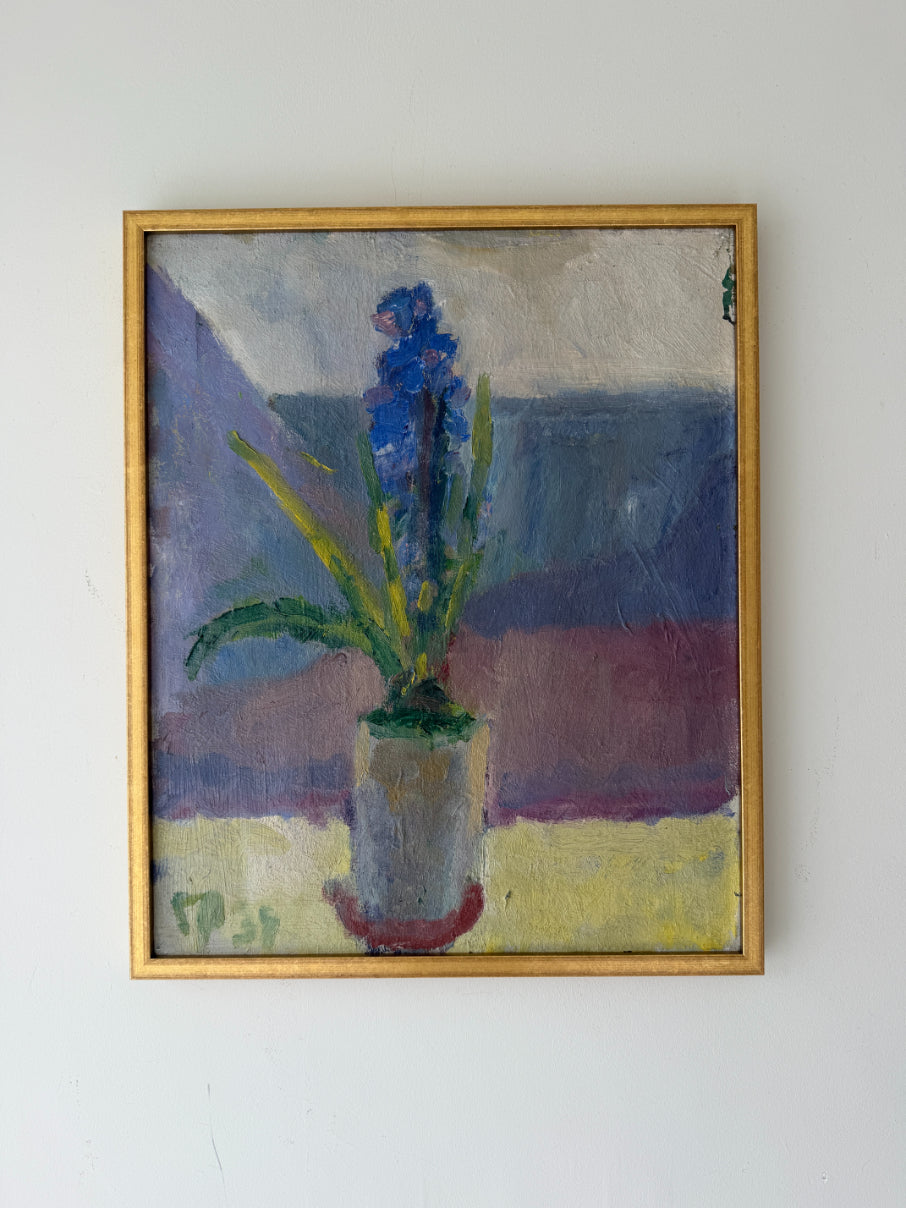 A framed vintage oil painting of a blue hyacinth in a pot. Available at Hue. 
