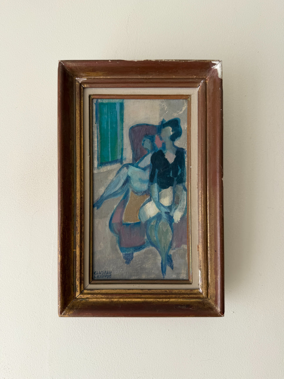 A framed vintage expressionist painting depicting two figures seated indoors on a sofa. Available at Hue.