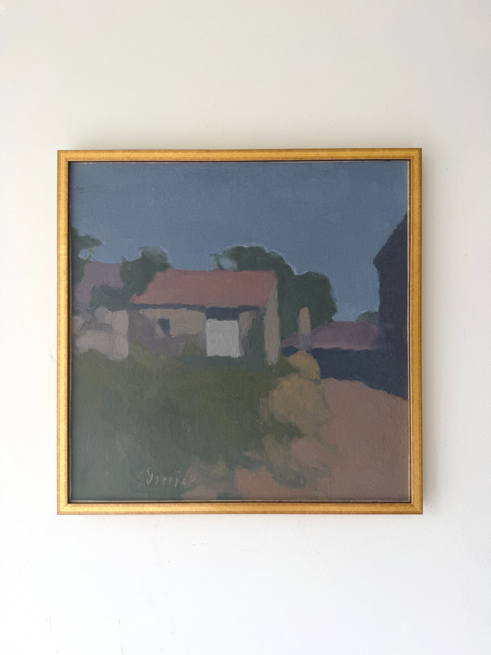 A framed vintage oil painting of French village scene with muted colours in a slim gold frame. Available at Hue. 