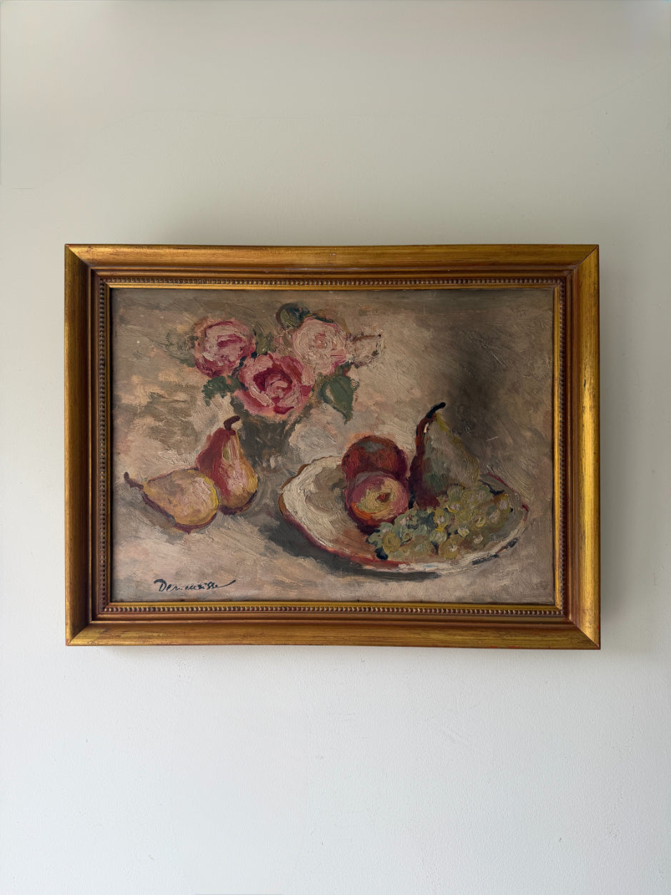 A framed vintage still life oil painting featuring pears, apples, and a bouquet of pink roses, housed in a gold-coloured frame. Available at Hue. 