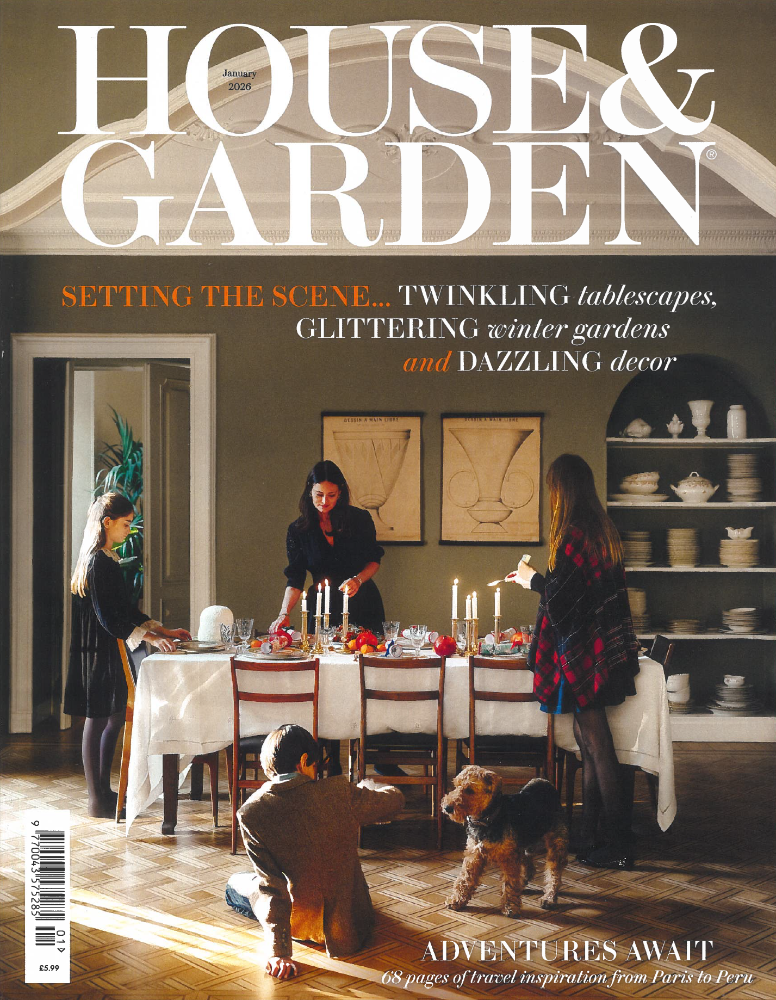 House & Garden magazine cover featuring a warmly styled dining room with a candlelit table, framed vintage art and winter décor.