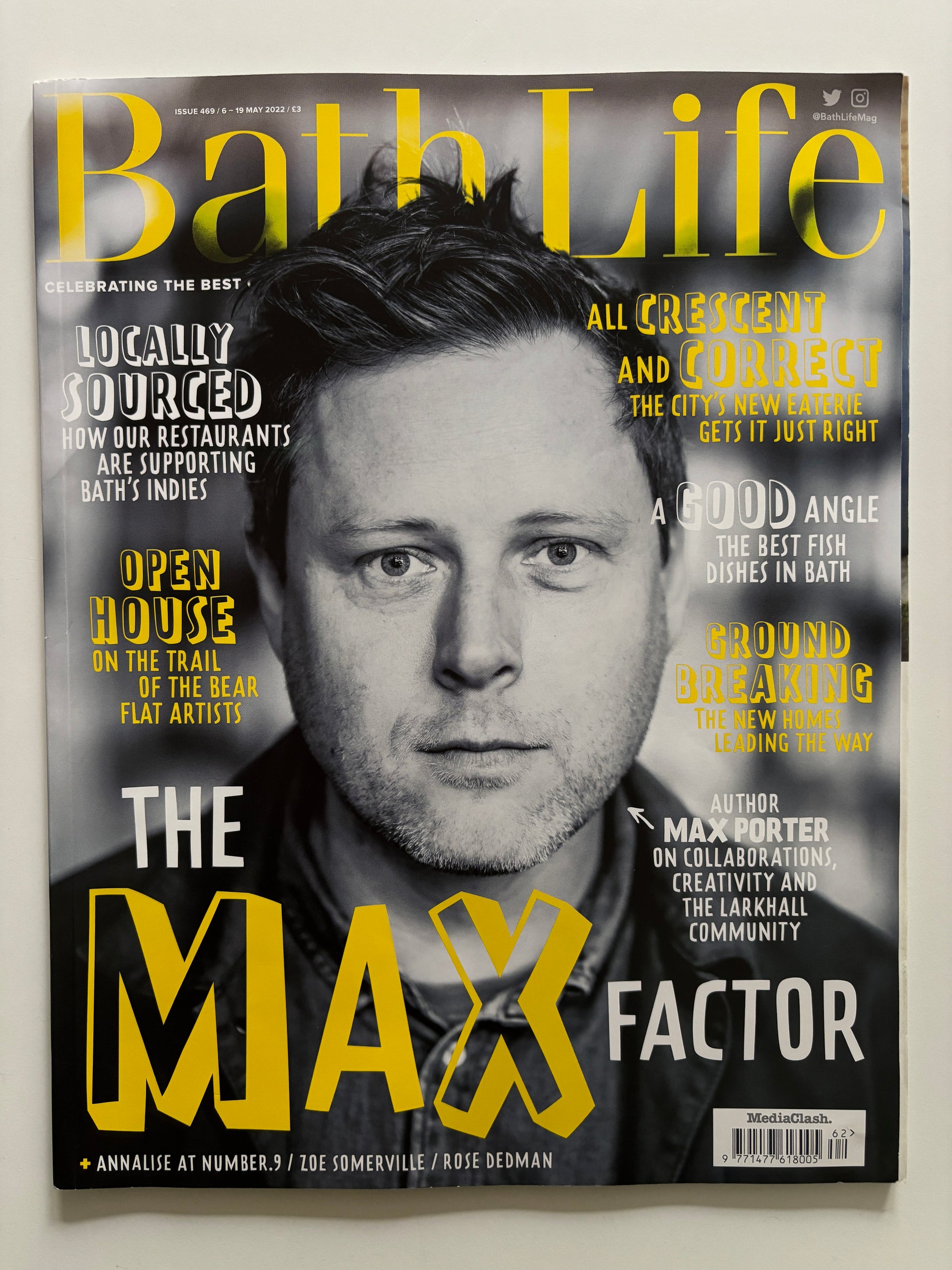 Magazine cover featuring a man's face with 'Max Factor' branding and text.