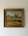 A framed vintage oil landscape painting featuring leafless trees in a grassy field. Available at Hue. 