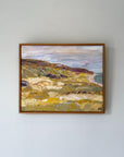 A framed vintage impressionist oil painting of a coastal landscape. Available at Hue. 