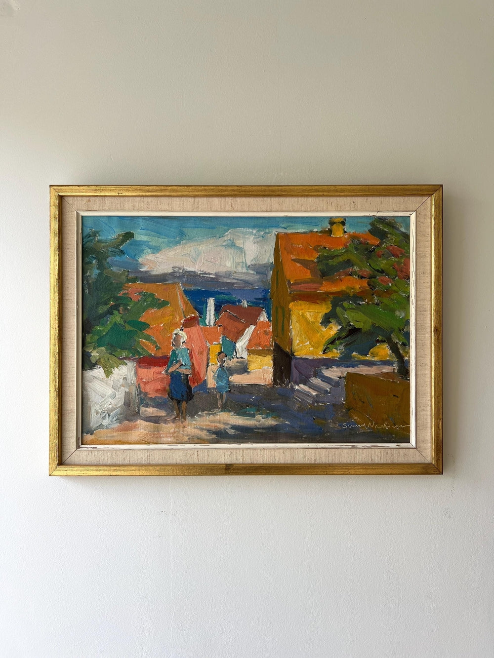 Framed vintage oil painting of a village scene with figures, available at Hue.