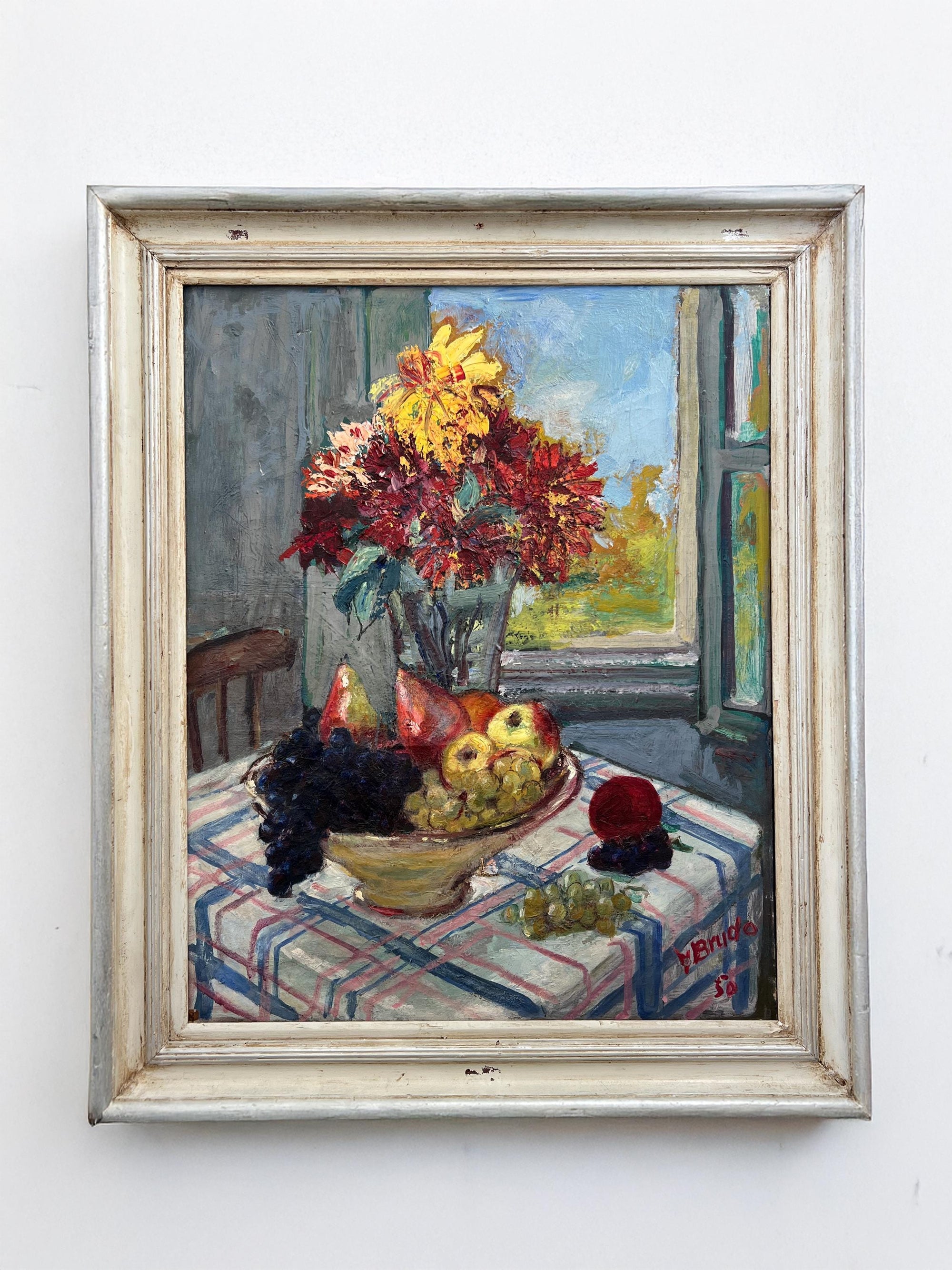 Framed painting of a still life scene with dahlia flowers and fruit on a table. available from hue.