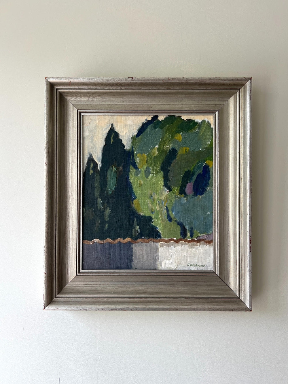 Framed painting of a landscape with abstract green trees on a white wall available from hue