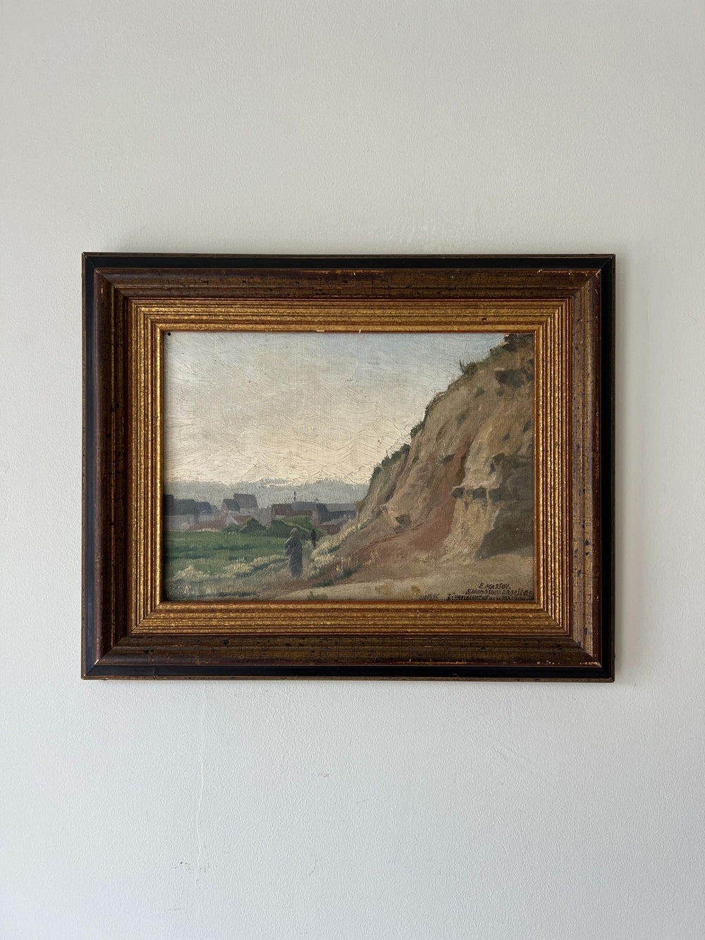 Framed antique painting of a rural landscape in a vintage frame, available at Hue.