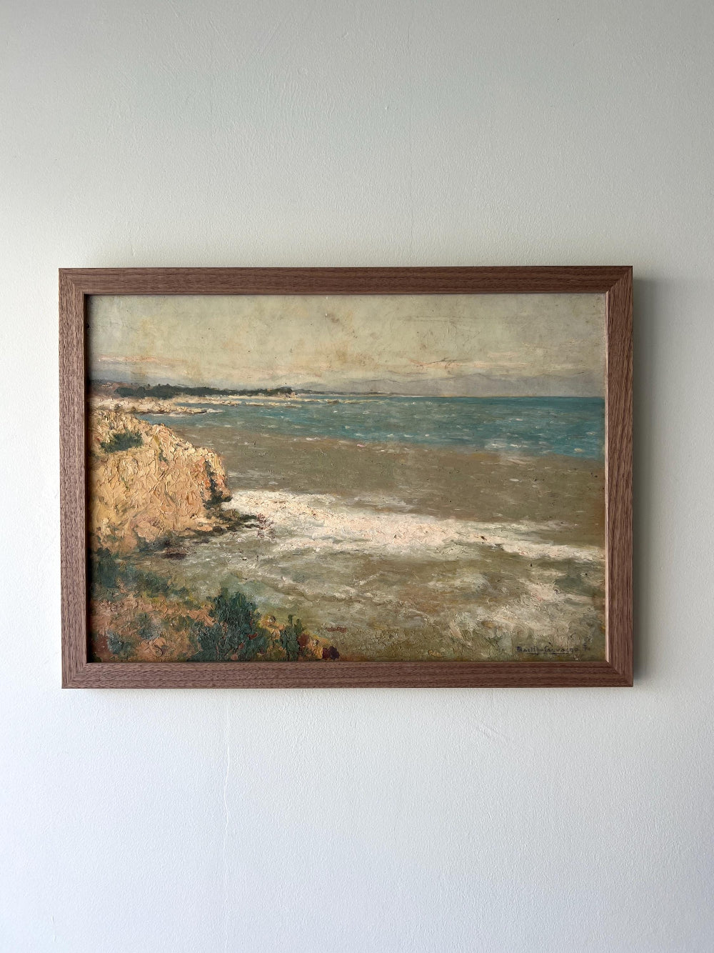 Framed vintage oil painting of a coastal scene in a solid walnut frame, available at Hue