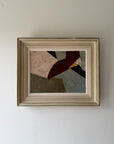 A framed abstract geometric oil painting featuring beige, deep burgundy, grey, and black shapes, housed in a distressed off-white wooden frame. Available at Hue. 