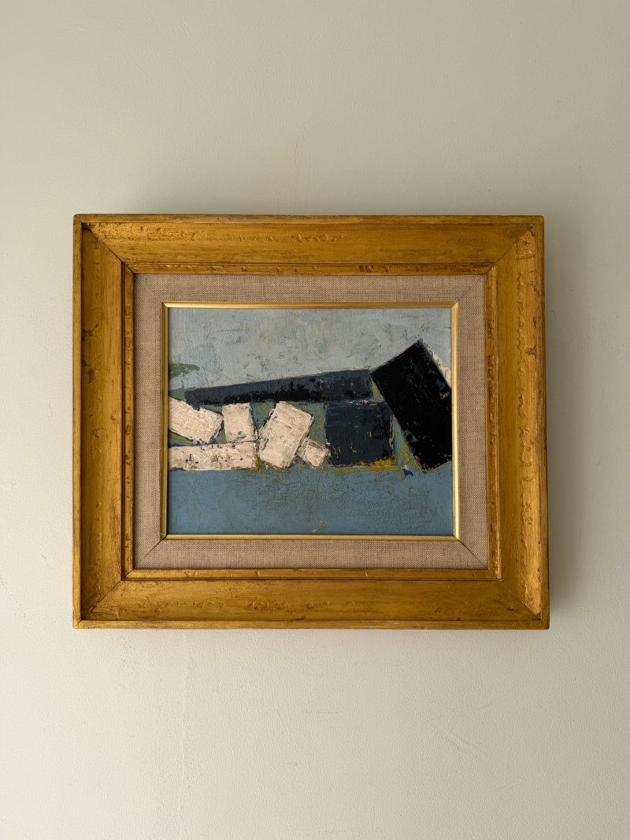 A framed abstract oil painting featuring blue, black, and white geometric shapes, housed in a rustic gold-toned wooden frame. Available at Hue.