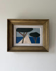 A framed semi-abstract landscape oil painting featuring stylized trees and geometric shapes in blue, black, beige, and brown. Available at Hue. 