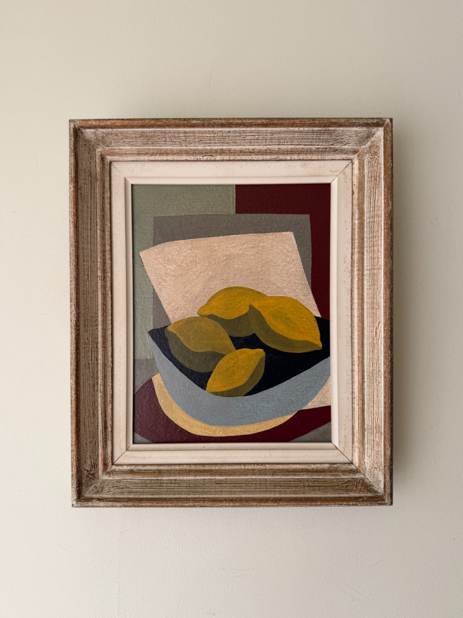 Framed semi-abstract oil painting of geometric shaped lemons in a blue bowl. Available at Hue.