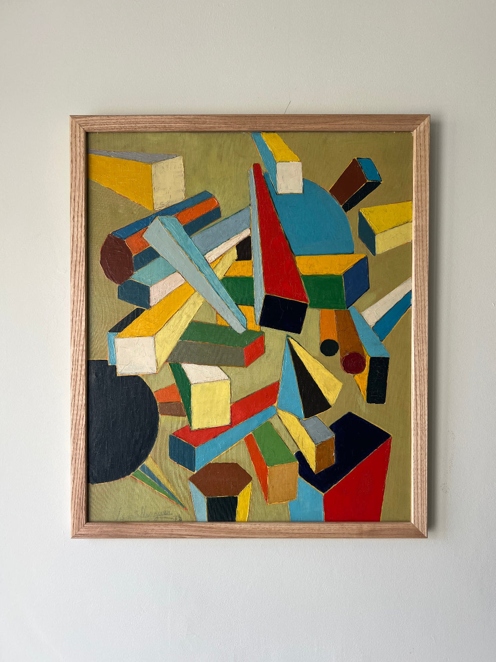 Framed abstract vintage art with geometric shapes in a wooden oak frame, available at Hue.