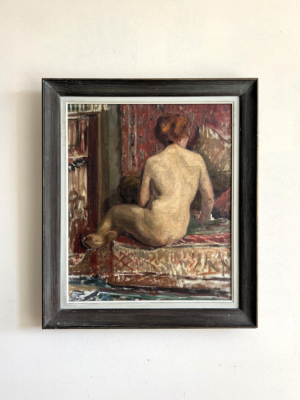 Framed vintage oil painting of a nude figure on a patterned rug, available at Hue