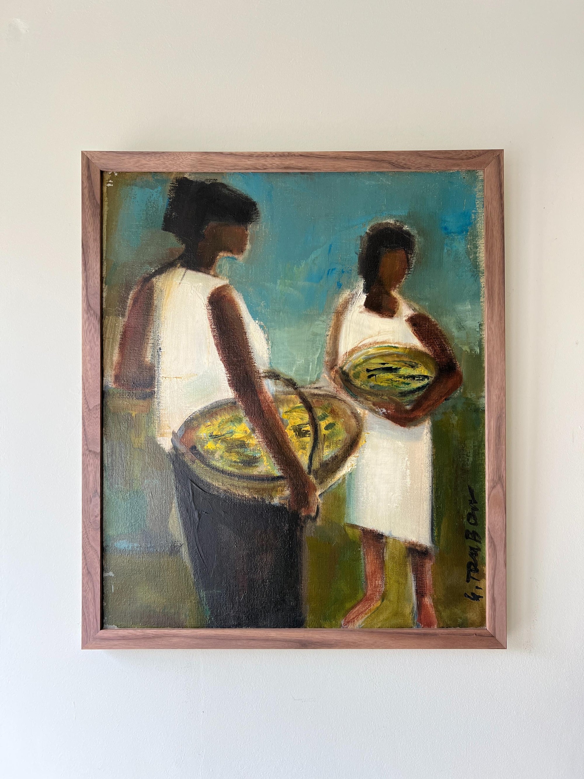 A framed vintage oil painting of two fisherwoman carrying baskets of fish on a teal background. Available at Hue. 