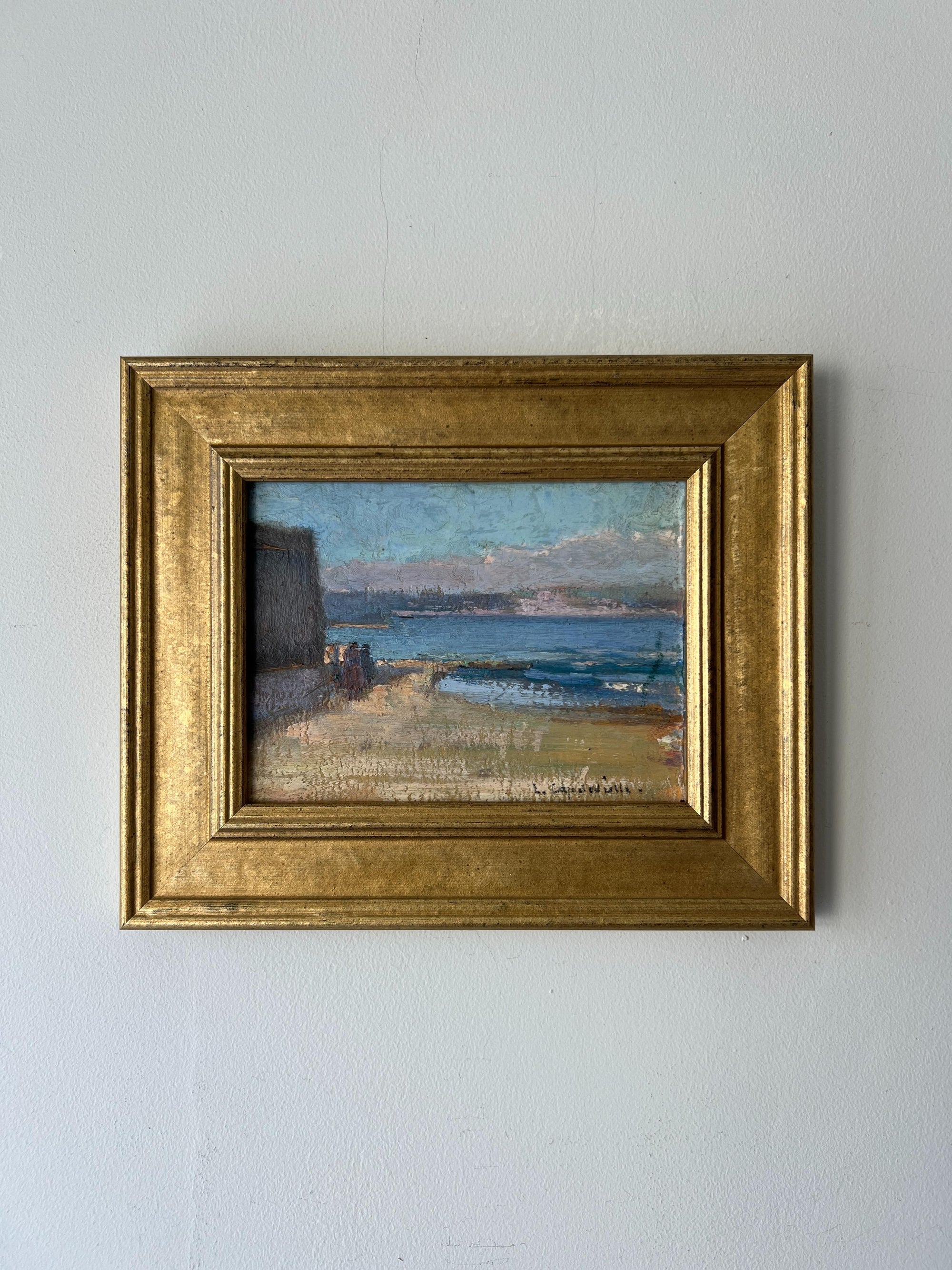 Framed vinatge painting of a coastal scene. Available at Hue. 