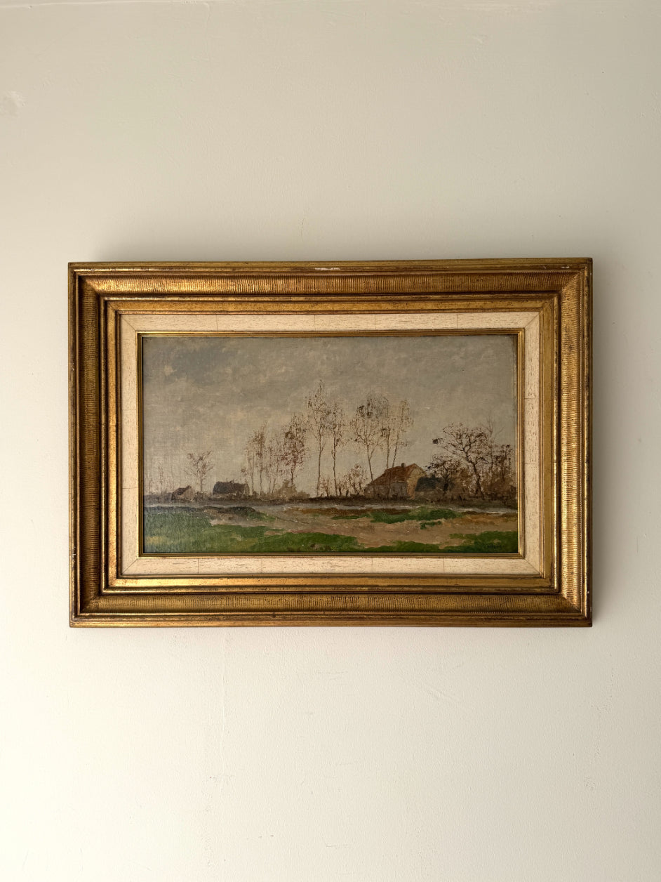 Framed vintage oil painting of a landscape with trees and farm buildings. Available at Hue. 