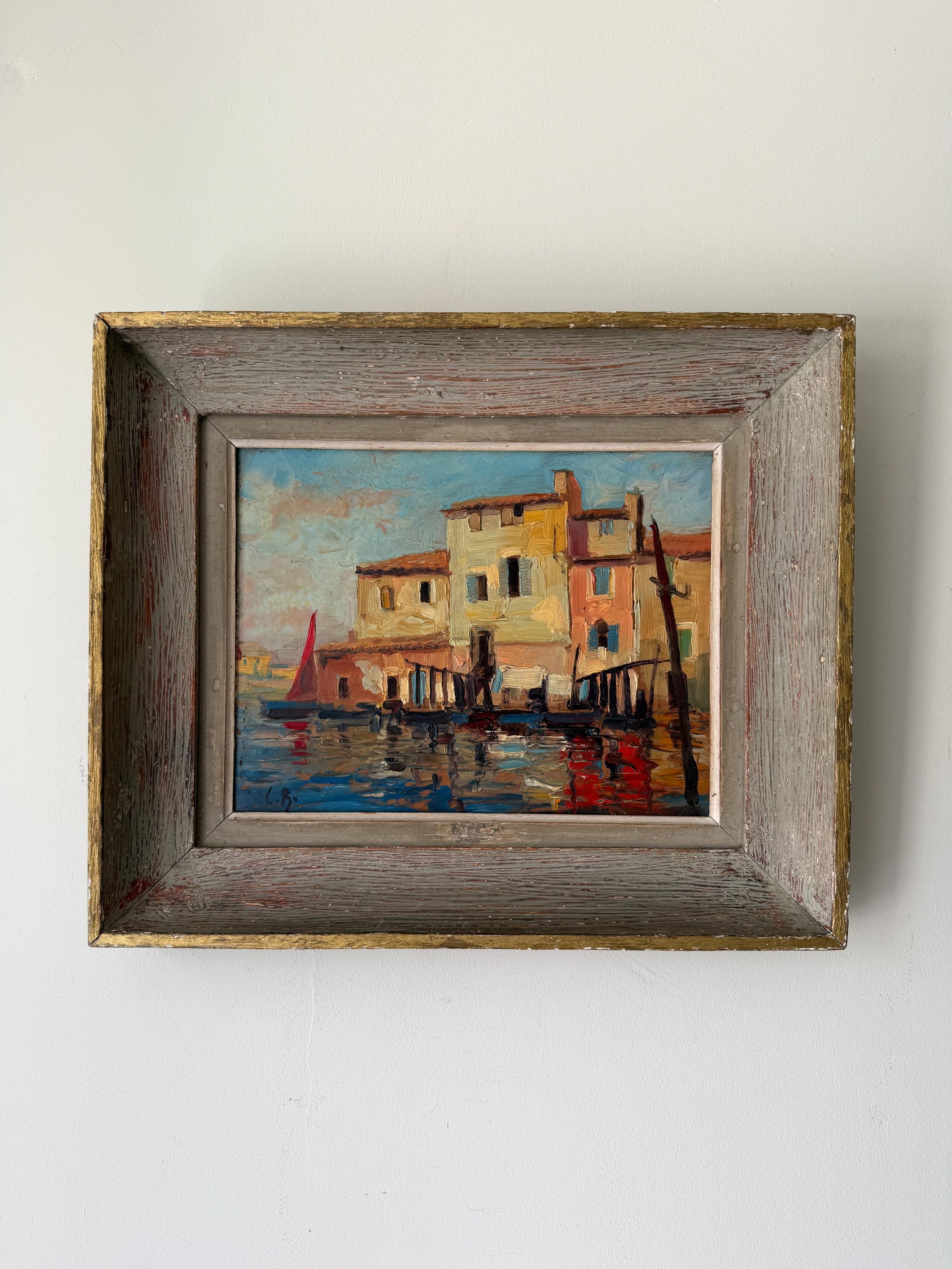 Framed vintage oil painting of a harbour scene with a sail boat. Available at Hue. 