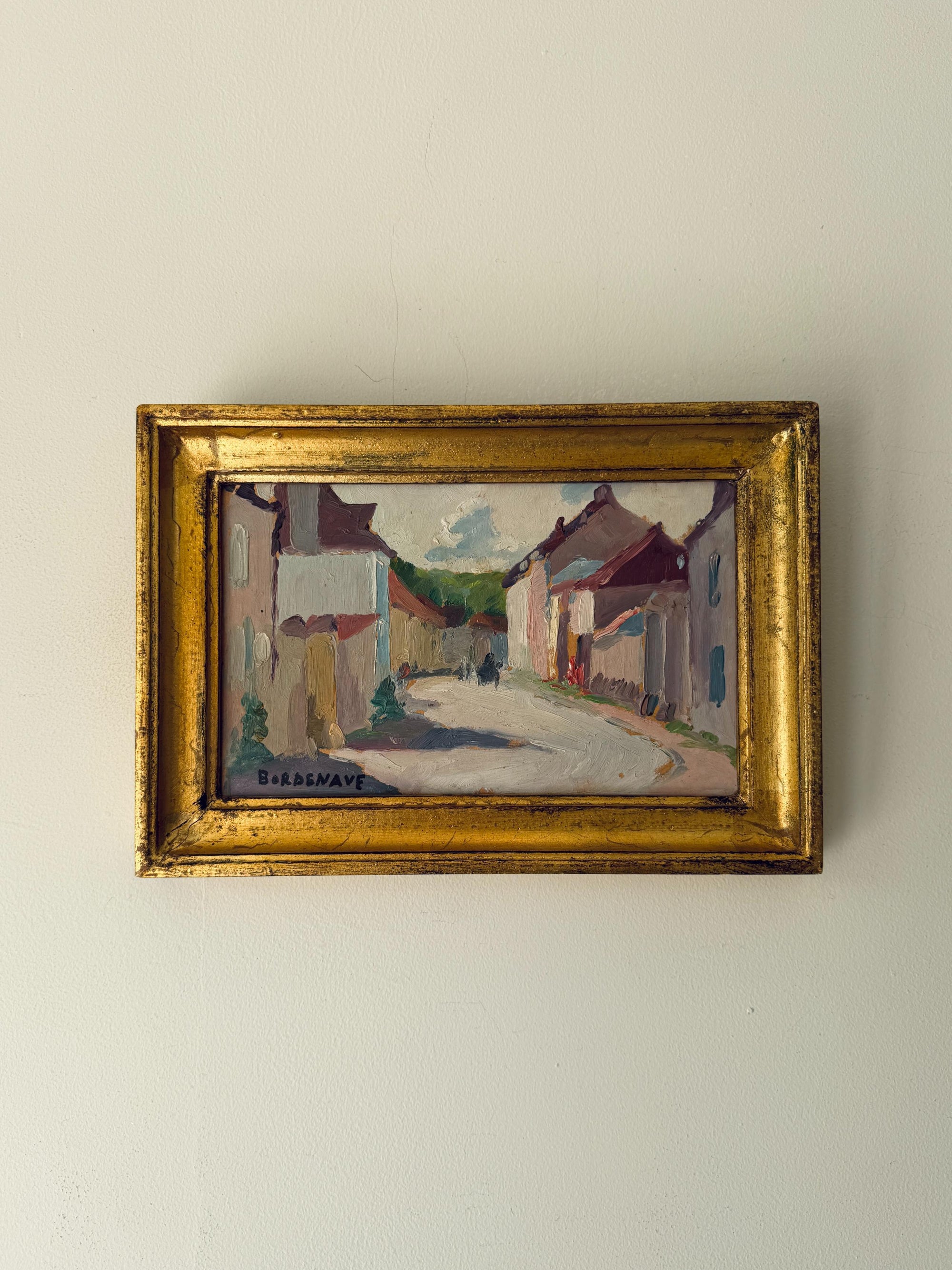 Framed vinatge oil painting of a village scene. Available at Hue. 