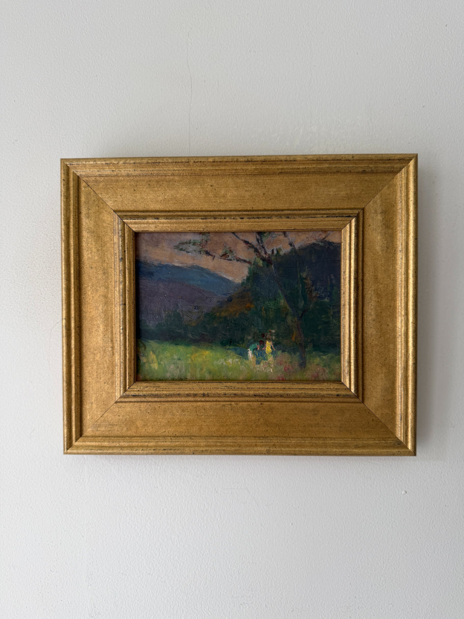 Small framed vintage oil painting of a landscape with hills and two children playing. Available at Hue. 