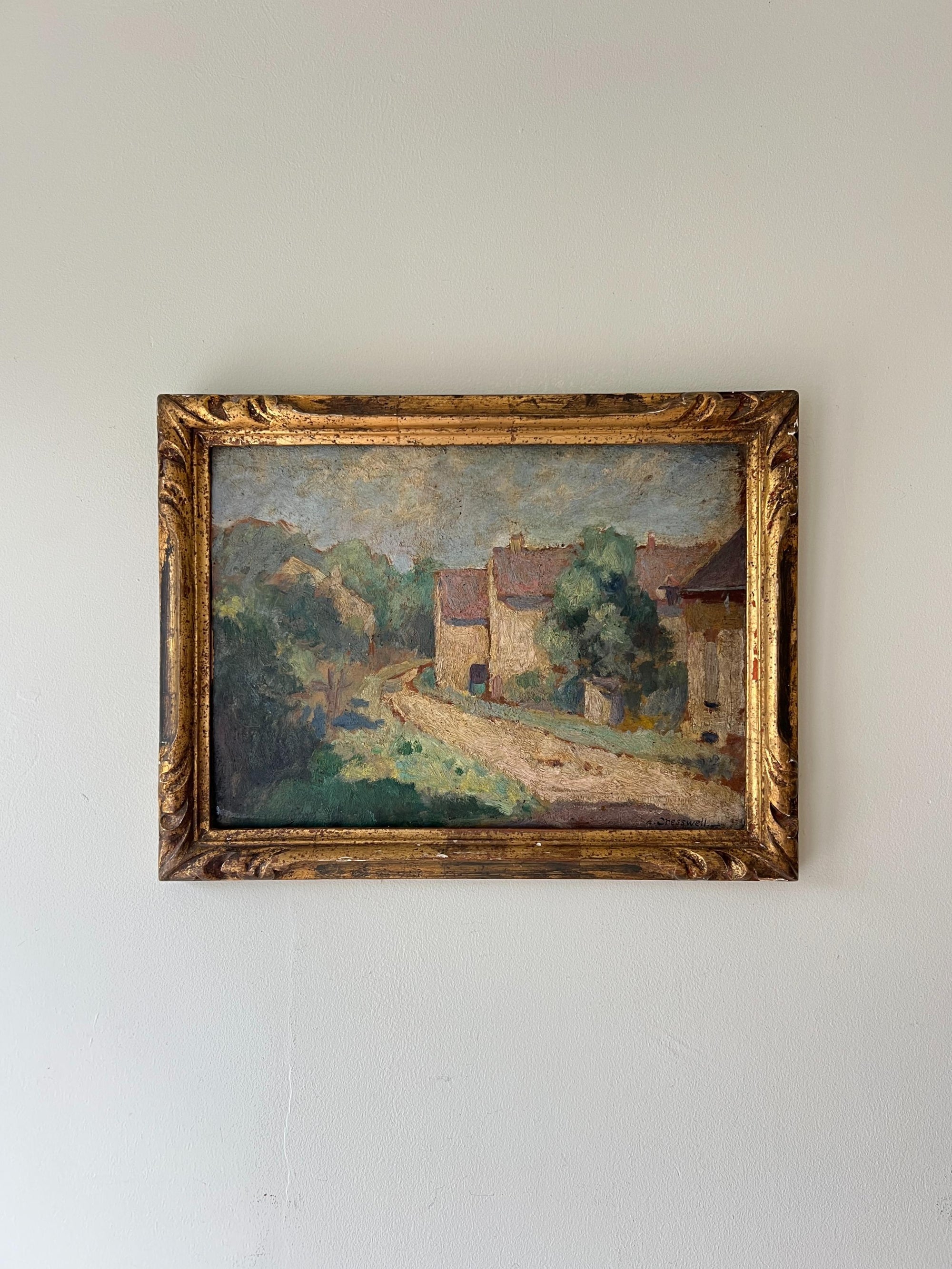 Antique oil painting of a french hamlet in an ornate gilt frame, available at Hue.