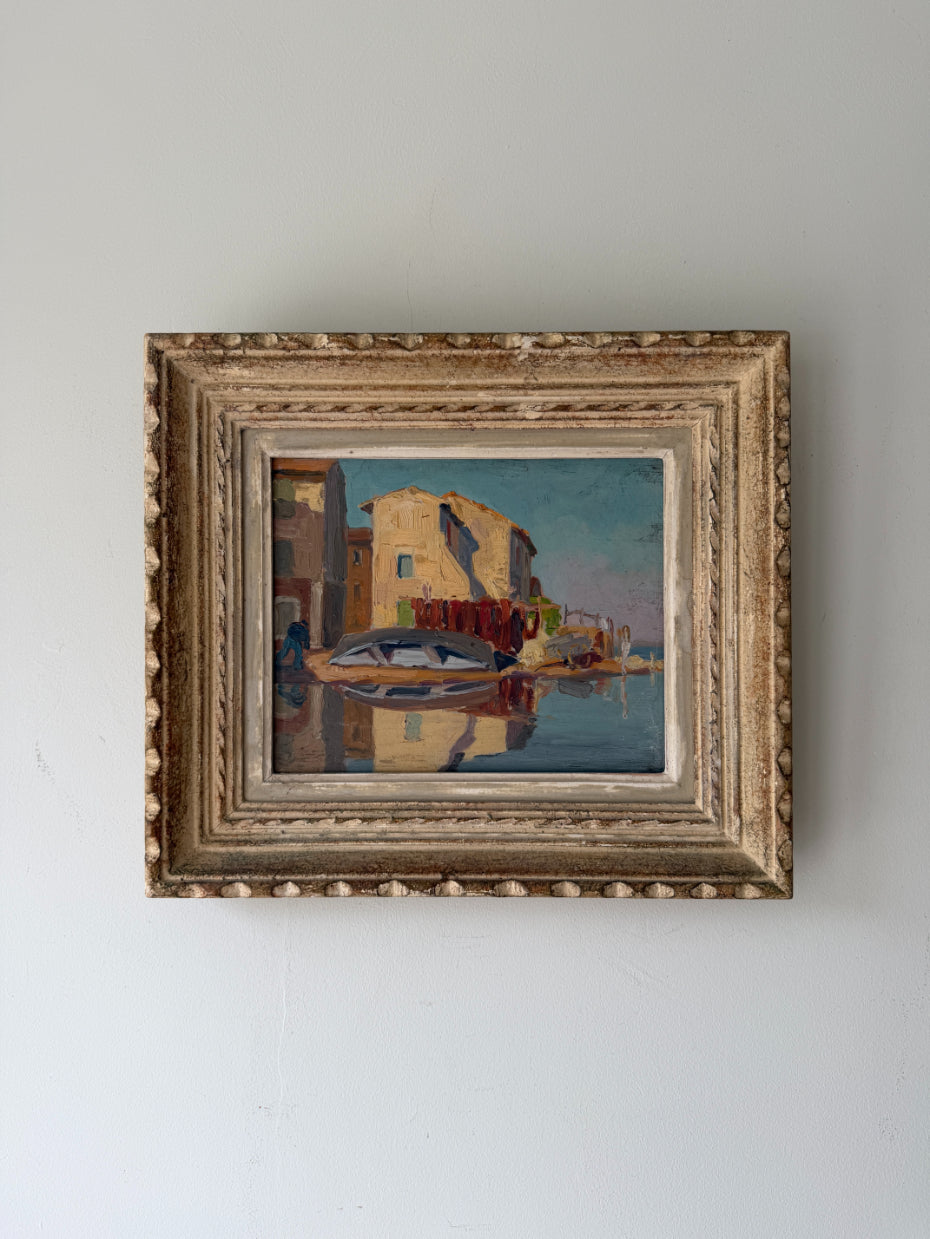 Ornately framed vintage oil painting of a harbour scene. Available at Hue. 